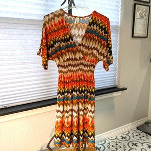 Gently used Cristinalove, size large, smocked waste dress